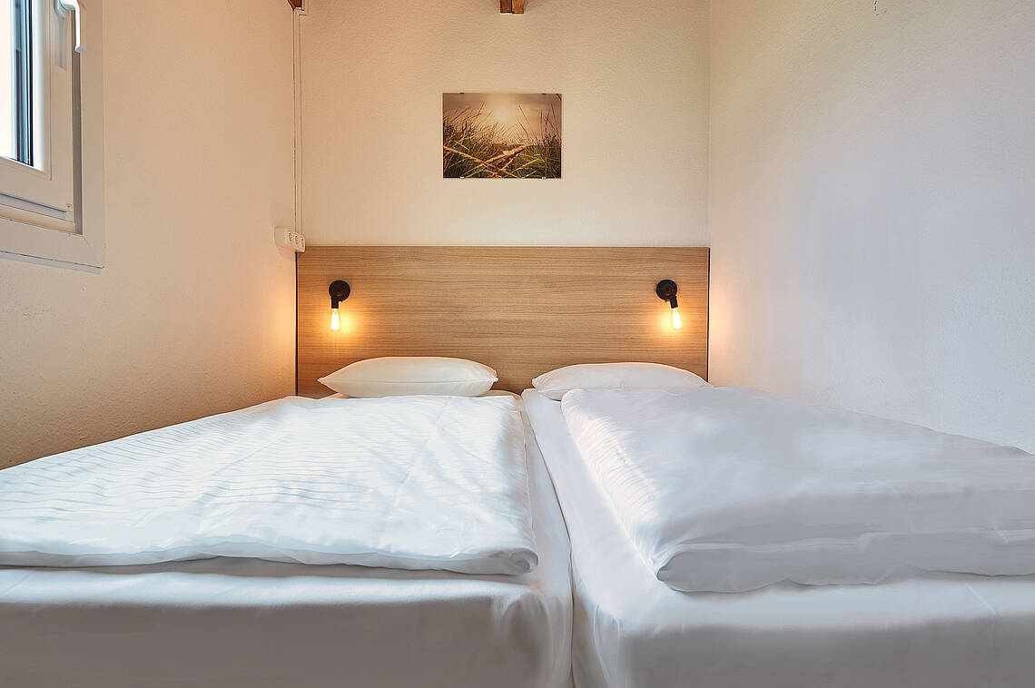 Schlafzimmer im Blockhaus